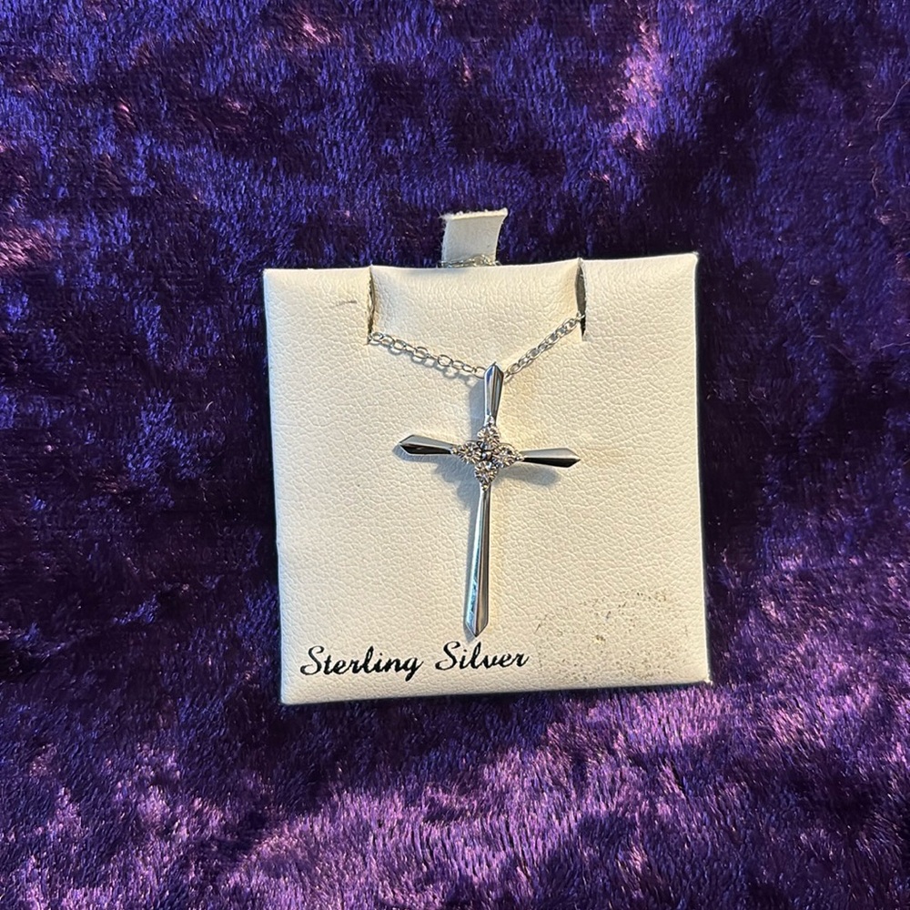 Sterling silver with .020 diamonds on cross pendant